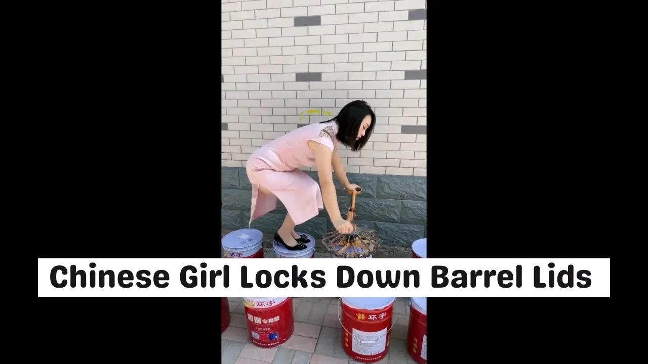 Cute Chinese Girl Locks Down Barrel Lids