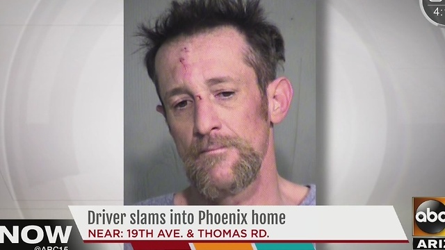 Mugshot released of driver who crashes into Phoenix home