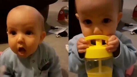 Cute baby helping his mom to feed himself