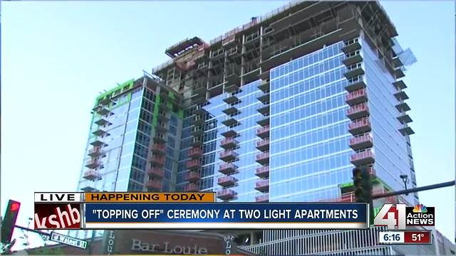 Final beam hoisted to top of KC's Two Light tower
