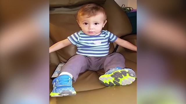 A Tot Boy Enjoys An Armchair Massage