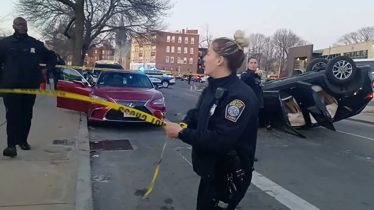 Boston police respond to a car rollover on Warren Street