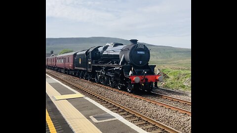 Black Five steam locomotive going over Ribblehead viaduct l