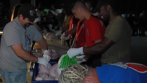 St. Lucie County firefighters prepare turkey dinners for families in need