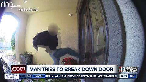 Shocking surveillance shows man hurling himself at a door, trying to break into home