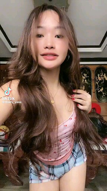 Sultry Sway: A Filipina Dance Delight""Watch as a captivating Filipina dancer blends cute charm with