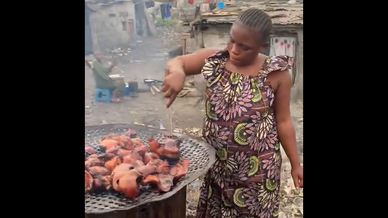 What Do You Think This Woman In Haiti Is Barbequing?