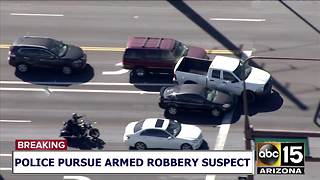 RAW: Pursuit suspect carjacks woman at west Phoenix intersection