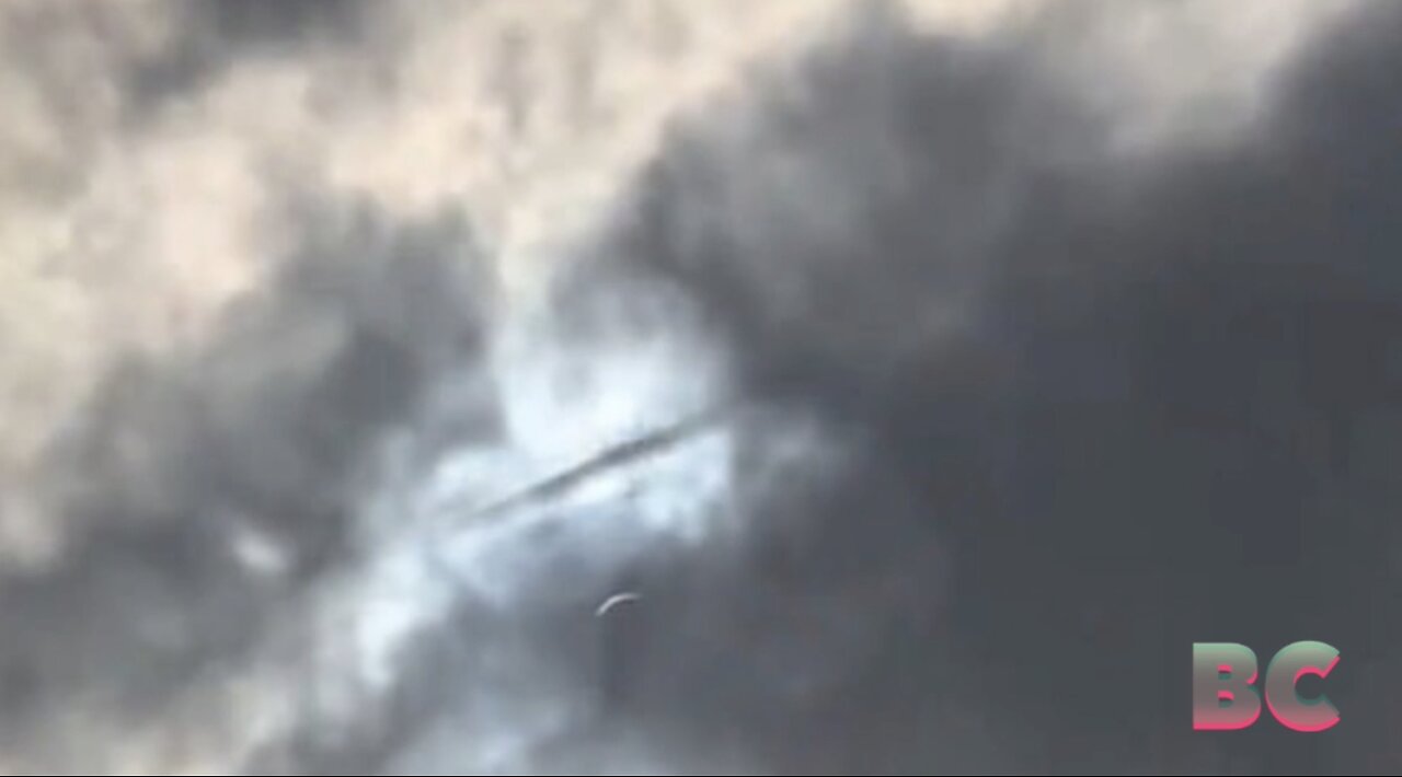 UFO spotted shooting through clouds over Texas during the solar eclipse