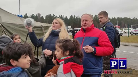 Belarus Poland Border Crisis International volunteers give toys to migrant children