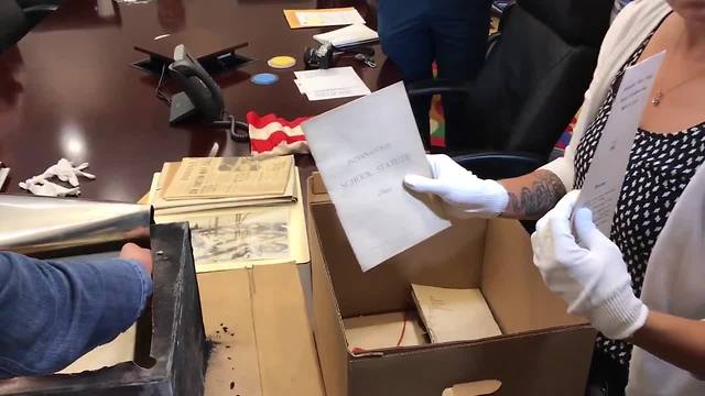 Indianapolis Public Library opens 100 year old time capsule