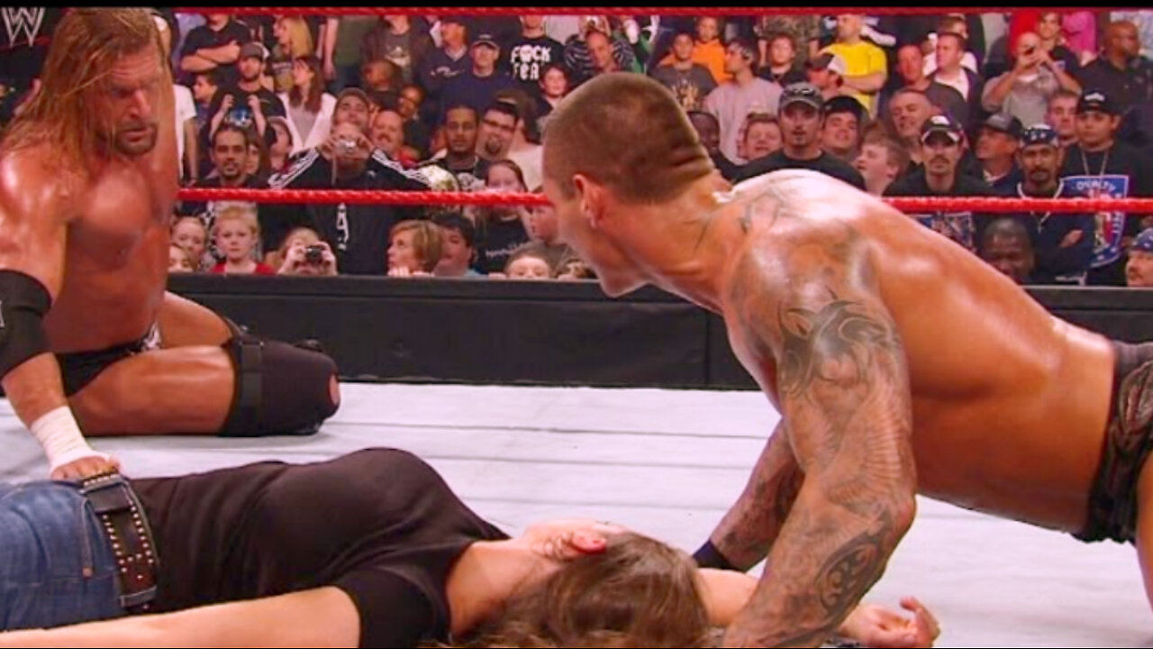 Randy Orton kisses an unconscious Stephanie McMahon right in front of Triple H.