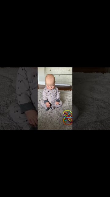 Cute adorable baby child with warm white and pink hat with cute baby girl