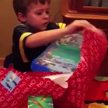 Young Boy Opens A Birthday Present And Finds LEGO!
