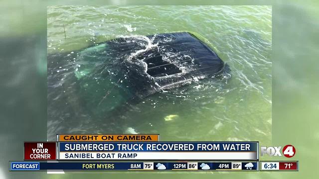 Truck rolls into water at boat ramp