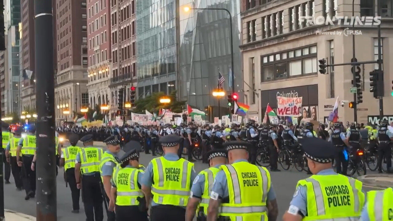 DNC Joy: Police Officers Marching Alongside Protesters In Attempt To Keep The Peace As Sun Goes Down