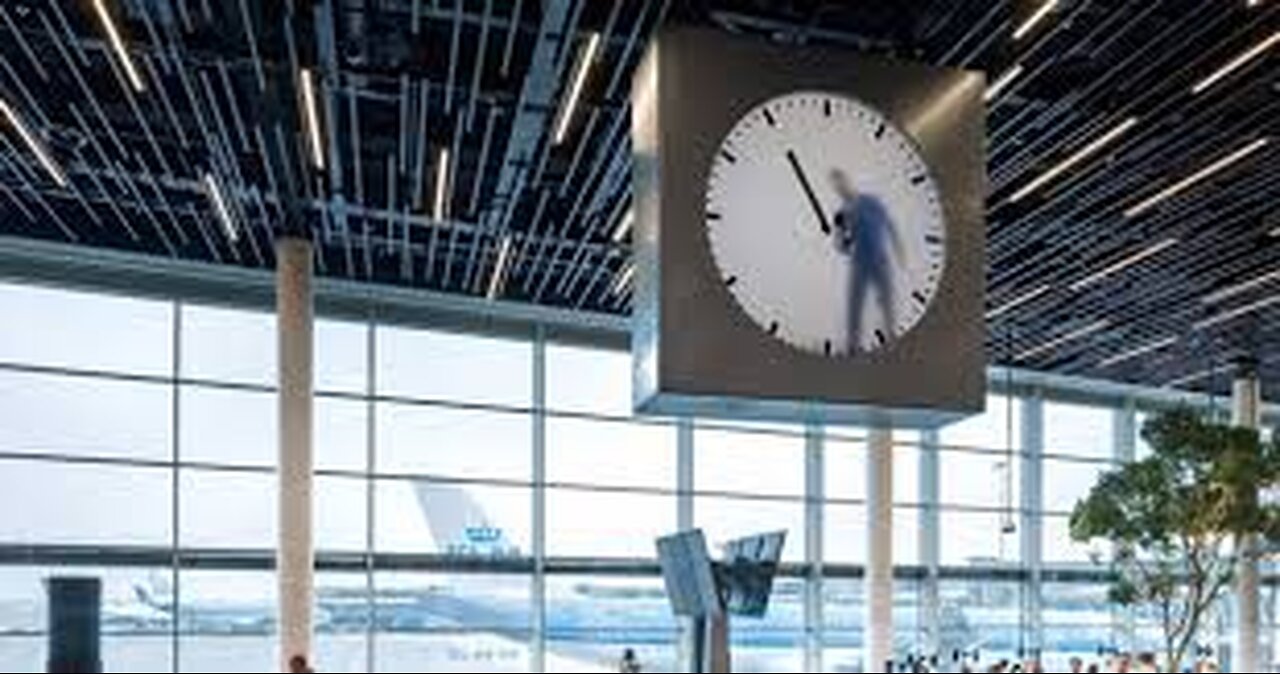 Schipol Clock - The illusion of a man is standing behind this giant airport clock