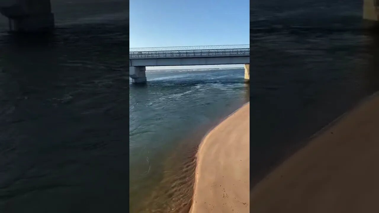 Water flowing under a bridge