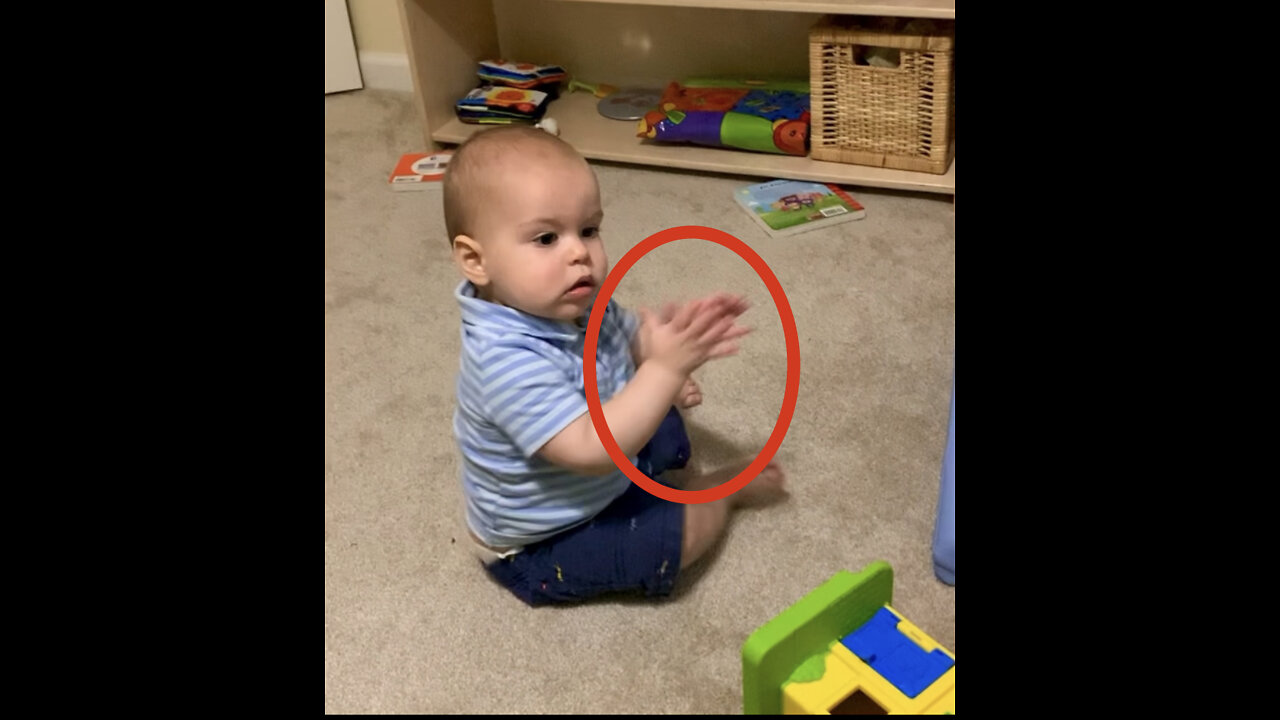 11-month-old baby uses signs to say, “More food, please.”