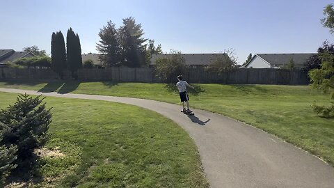 Yung Alone Rides Down Hill At Madrona Park