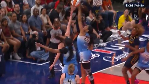 WNBA player Angel Reese forcefully elbows Caitlin Clark in the head as she attempts a layup