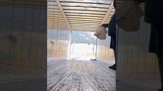 Cleaning out a semi trailer before being loaded