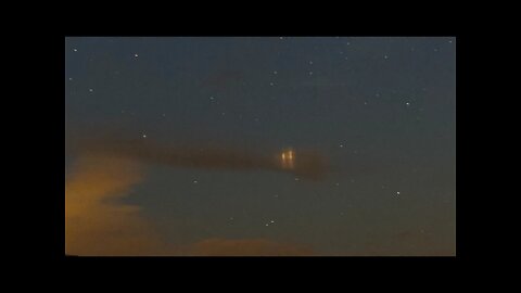 Ghost lights in the clouds.. Light pillars?