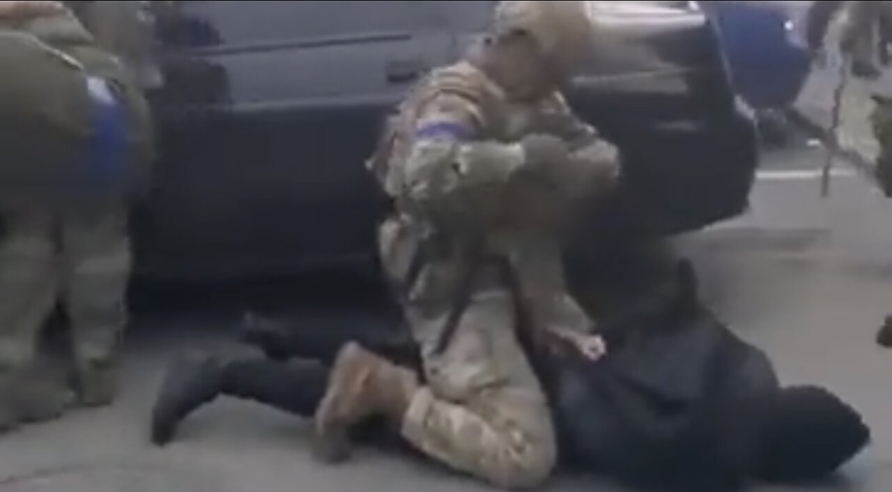 Reports suggest this is Ukrainian troops against civilians accused of "collaborating with Russia"
