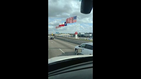 Giant flags in Dallas Texas On a windy day