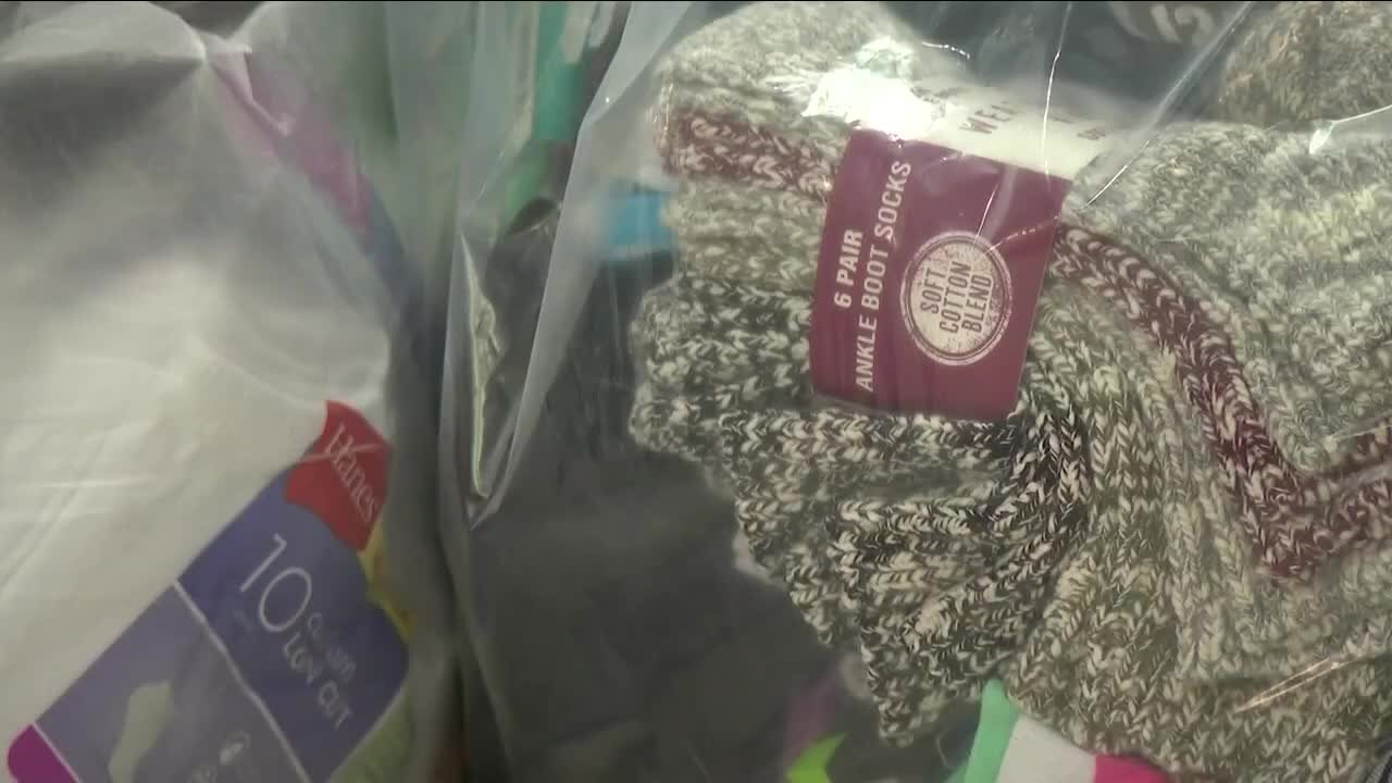 Group giving socks to Marshall Fire victims