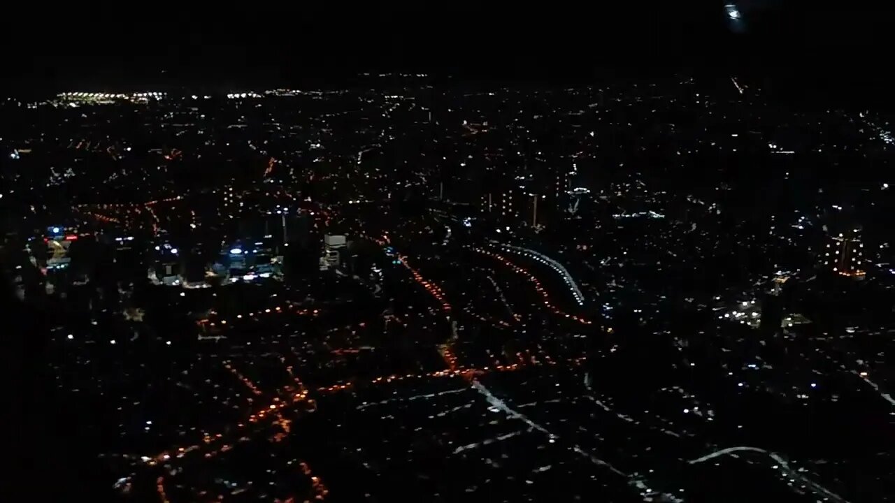 Aerial View of Manila at night PAL Flight Takeoff
