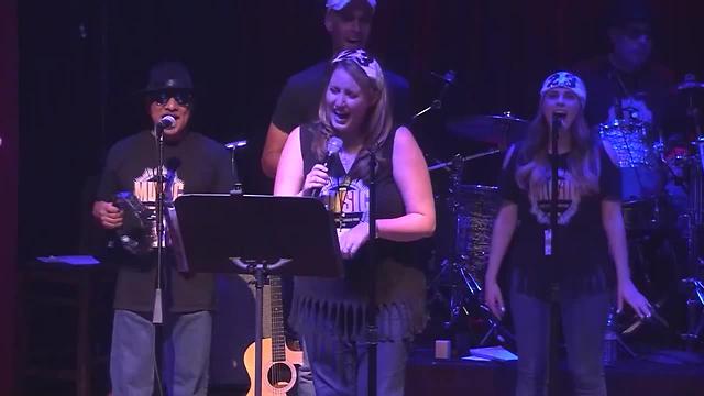Elaina Rusk singing "Life is a Highway" at the Media Music Jam