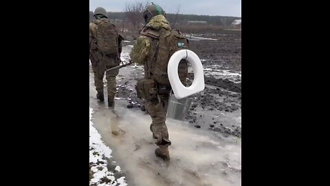 Ukrainian Soldier Carries Toilet