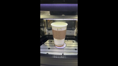 Mini starbucks coffee machine at gas station