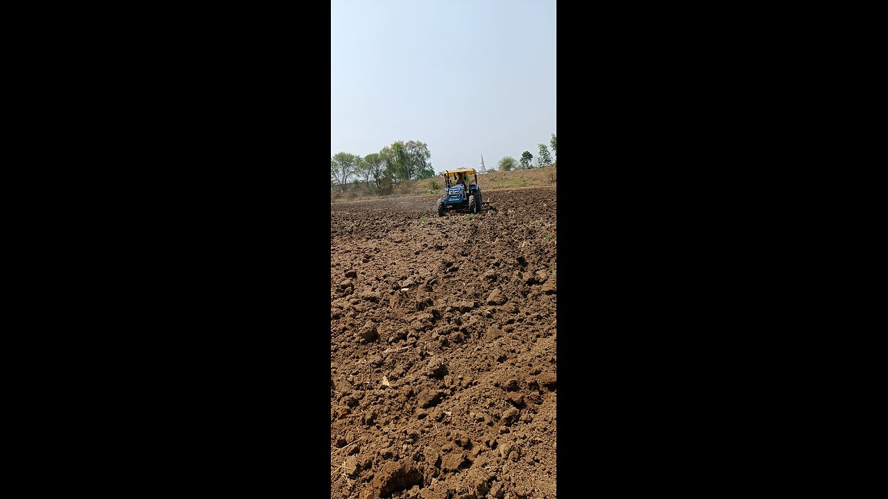 farmer plowing field