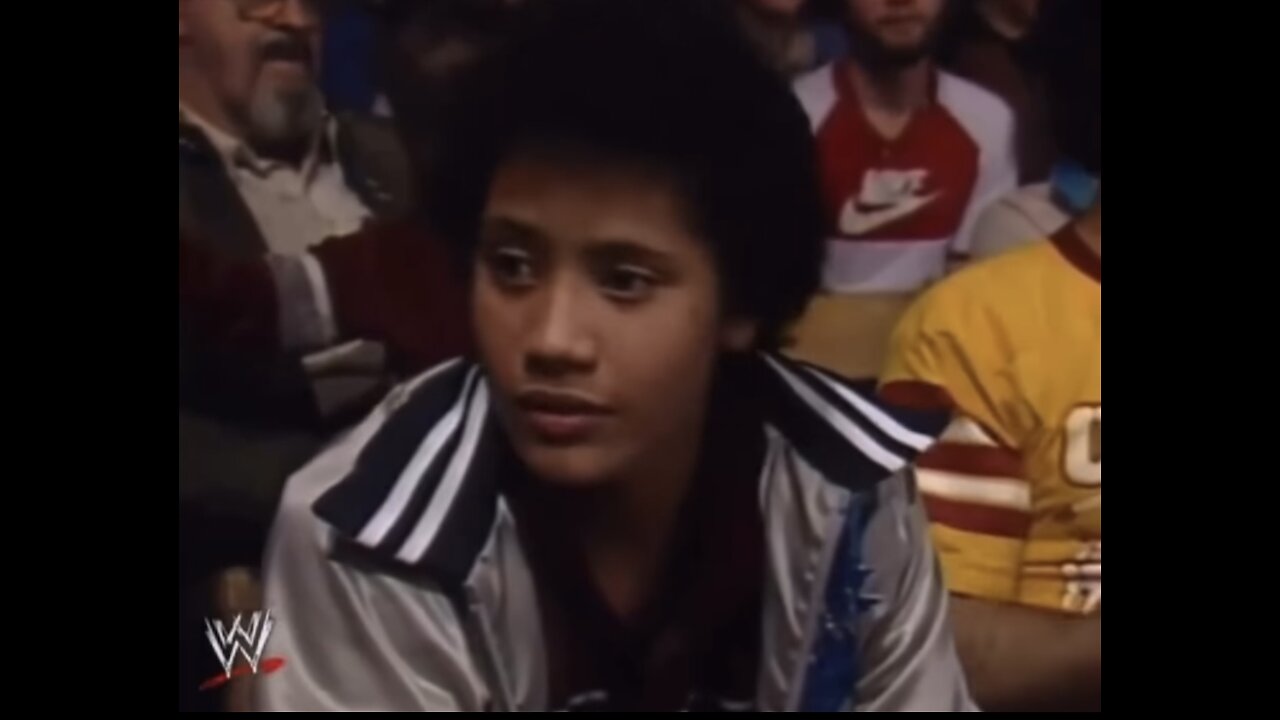 11 year old Dwayne “ The Rock “ Johnson sitting in crowd watching his dad wrestle in 1984