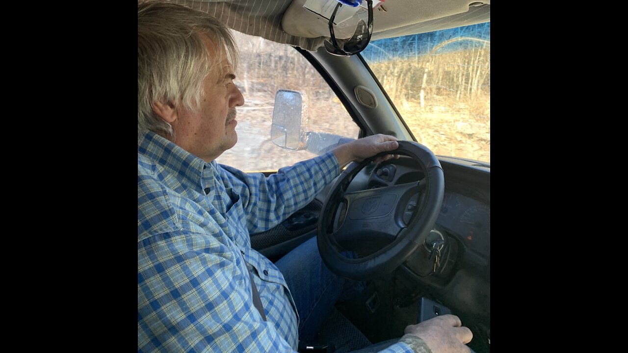 Farmer Dell Feeding hay on small Farm in Arkansas