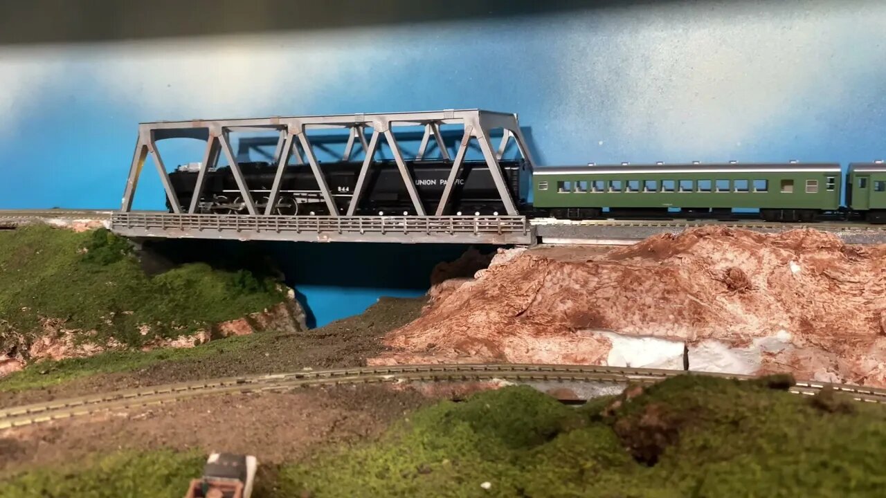 N Scale Kato FEF creeping across a rural bridge