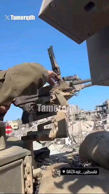 With a huge smile & immense satisfaction, Israeli soldier fires a machine gun indiscriminately ⏬desp