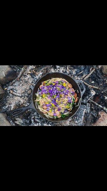 Cooking a Foraged Stirfry with Ramps and Violets.