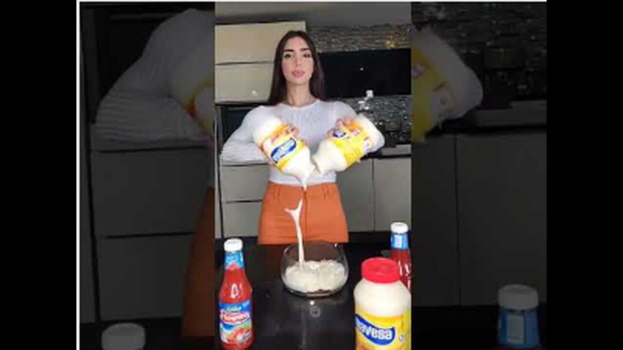 Sexy woman making burger