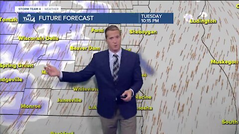 Mostly cloudy, breezy, and warmer Tuesday