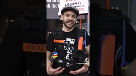 Guy Helping Cosplayer