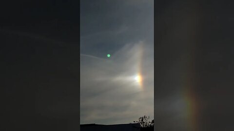 Signs in the sky:Arc exiting sun dog on parhelic circle in aerosol saturated stratosphere. SD,CA