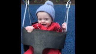 Cute baby slow motion swing