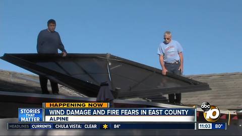 Winds blow gazebo onto roof in East County