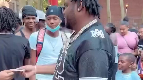 Tee Grizzley handing out cash in the hood