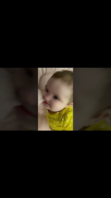 Cute adorable baby child with warm white and pink hat with cute baby girl