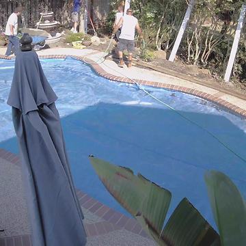 Construction Worker Falls in Pool with Wheelbarrow