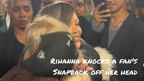 Rihanna snacks a fan's Snapback off her head tops